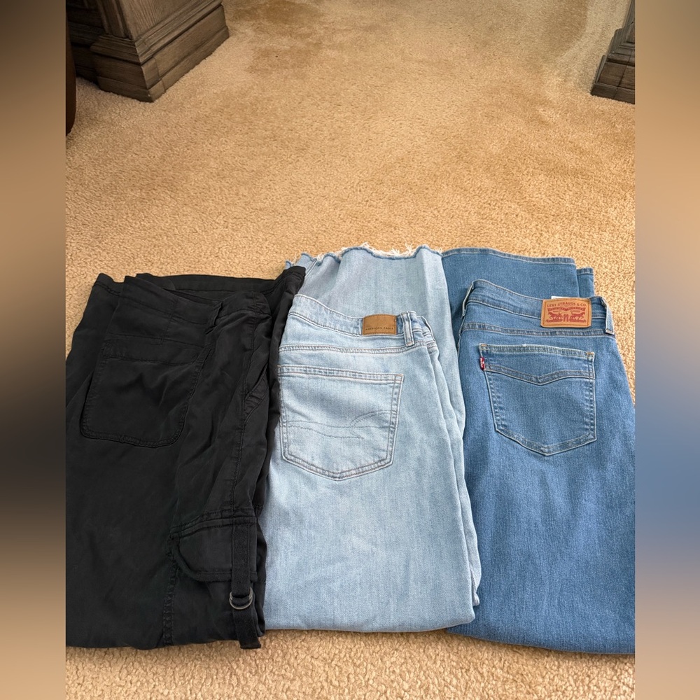 3 pairs of Pants American Eagle Black, Light Blue, and Levi’s  Blue Women Jeans